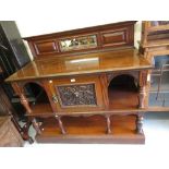 Late 19th or early 20th Century walnut side cabinet with a low mirrored moulded back above a