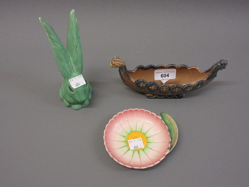 Sylvac green pottery figure of a long eared rabbit, together with a Carlton ware dish and a Wade