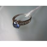 9ct White gold tanzanite set ring with cubic zircona set shoulders