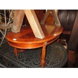 Reproduction mahogany and inlaid oval coffee table on fluted supports