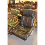 20th Century Norwegian black leather upholstered and chrome reclining armchair, together with a