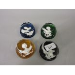 Set of four Bacarat coloured glass paperweights with various figures of the Royal family including