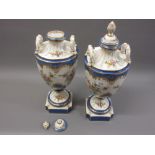 Pair of large continental two handled pedestal vases with covers in Sevres style with floral painted