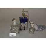 Small clear glass silver mounted perfume bottle, another similar with silver plated mounts and a