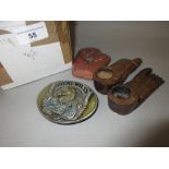 Bergamot cast metal Hog Wild buckle, pair of carved wooden shoe form candlesticks and a small carved