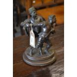 Emile Guillemin, brown patinated bronze group of two swordsmen, signed in the oval base (with