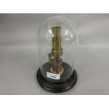 Late 19th/early 20th Century lacquered brass monocular under a small glass dome with ebonised plinth
