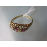18ct Yellow gold ring set three rubies and four small diamonds