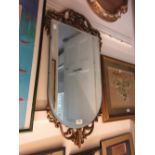 20th Century shaped wall mirror having gilt pierced partially framed mirror, rectangular oak