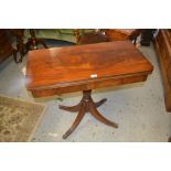 Reproduction mahogany rectangular fold-over card table on a turned column support and quadruped base