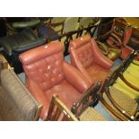 Two 19th Century button upholstered armchairs on turned tapering front supports with brass and
