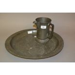 18th Century London pewter circular charger together with a pewter quart jug 17ins diameter