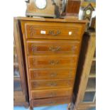 20th Century French cherry wood semainier , the moulded parquetry inlaid top above seven drawers