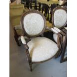 Pair of 20th Century floral carved and gilt open armchairs