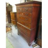 George III mahogany chest on chest, the moulded and inlaid cornice above two short and six long