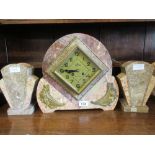 Art Deco pink and beige marble gilt metal mounted three piece clock garniture, the shaped case