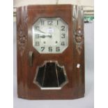 Continental Art Deco walnut cased wall clock, the octagonal silvered dial with Arabic numerals,