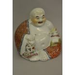 Early 20th Century Chinese porcelain enamel decorated figure of a seated Buddha, bearing impressed