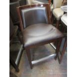 Nineteen matching simulated brown leather upholstered bar stools with square tapering supports and