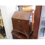 Reproduction mahogany bureau with a fall front