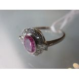 18ct Yellow gold oval pink sapphire and diamond cluster ring The ring is modern and in 'as new'