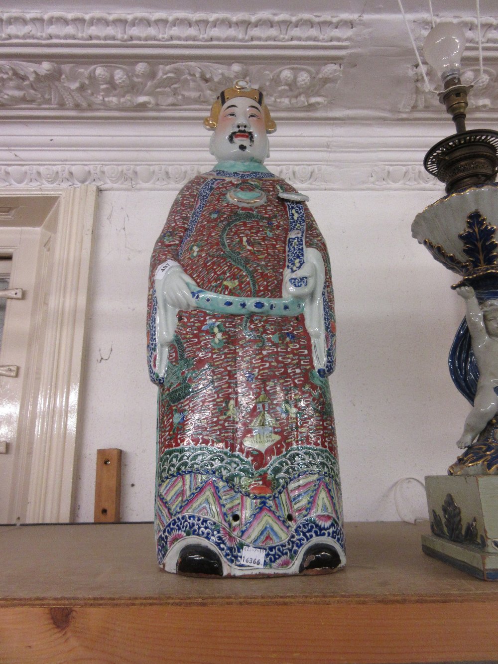 Large 20th Century Chinese terracotta figure of a man holding a scepter in dragon decorated robes,