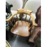 20th Century oak, elm and beech bow back smokers chair on heavily turned supports with stretchers