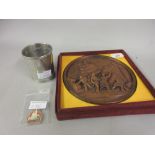 Cased resin plaque, an American University of London beaker and an enamel badge (from the Harold