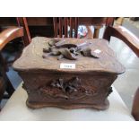 19th Century Black Forest carved cigar box, the hinged lid enclosing a fitted interior with