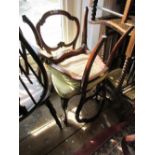 Pair of Victorian carved walnut balloon back side chairs