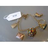 9ct Gold curb link charm bracelet with padlock clasp, with six charms including a small 22ct gold