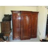 Victorian mahogany breakfront wardrobe, the moulded cornice above three doors enclosing hanging