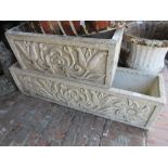 Rectangular cast concrete garden planter together with a similar smaller planter