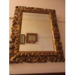 19th Century Florentine type carved and gilded rectangular wall mirror with bevelled plate, 35ins