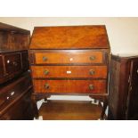 20th Century walnut bureau having fall front enclosing fitted interior above three drawers on