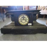 Large 19th Century black slate mantel clock, the circular enamel dial with Roman numerals, the two