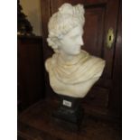 19th Century marble bust of a Greco Roman male figure (at fault), on a slate and wooden stand, 18.