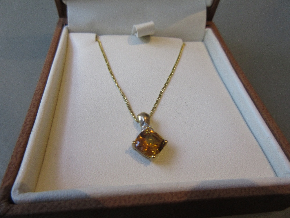9ct Gold pendant set citrine and diamonds on a 9ct gold chain