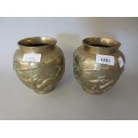 Pair of Far Eastern baluster form bronze vases relief moulded with deer and birds