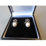 Pair of pearl and diamond bow form drop earrings
