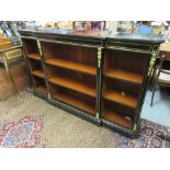 Victorian ebonised and gilt brass mounted dwarf breakfront bookcase, the moulded top above