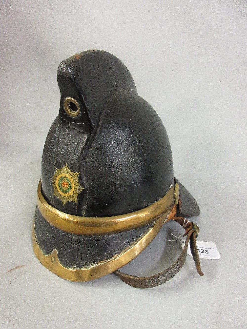 Early 20th Century James Hendry patent leather fireman's helmet with transfer printed badge