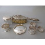 Two silver napkin rings, two plated napkin rings, silver topped cut glass jar, silver cover and a