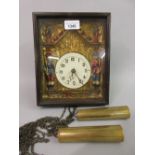Black Forest frame clock having embossed gilded dial with figures and Arabic numerals, 9ins x 7.