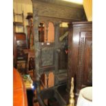 Large 19th Century carved oak hall stand with mask head pediment above a rectangular bevelled mirror
