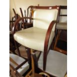 Group of seven 20th Century simulated cream leather upholstered open armchairs