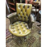 George IV buttoned leather upholstered library chair on fluted splay supports with brass casters