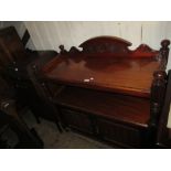 19th Century mahogany buffet having carved galleried top with undertier and two panelled doors on