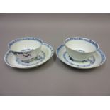 Pair of Nanking cargo blue and white tea bowls and saucers painted with prunus blossom (at fault)
