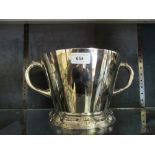 Large silver two handled wine cooler having gilded interior and tapering body on a cast circular